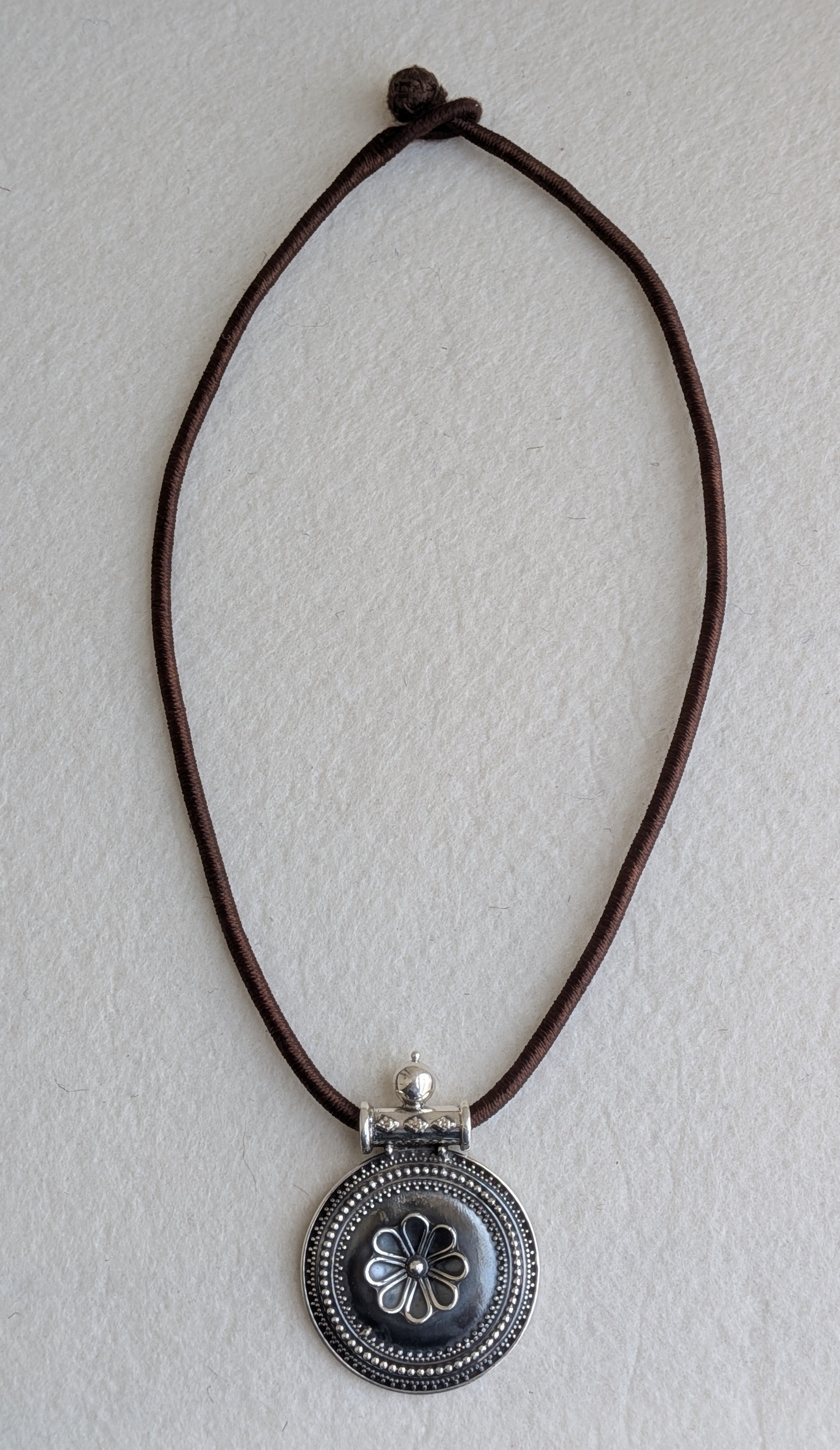 Dhara - Statement piece with round 925 Silver pendant and brown dori
