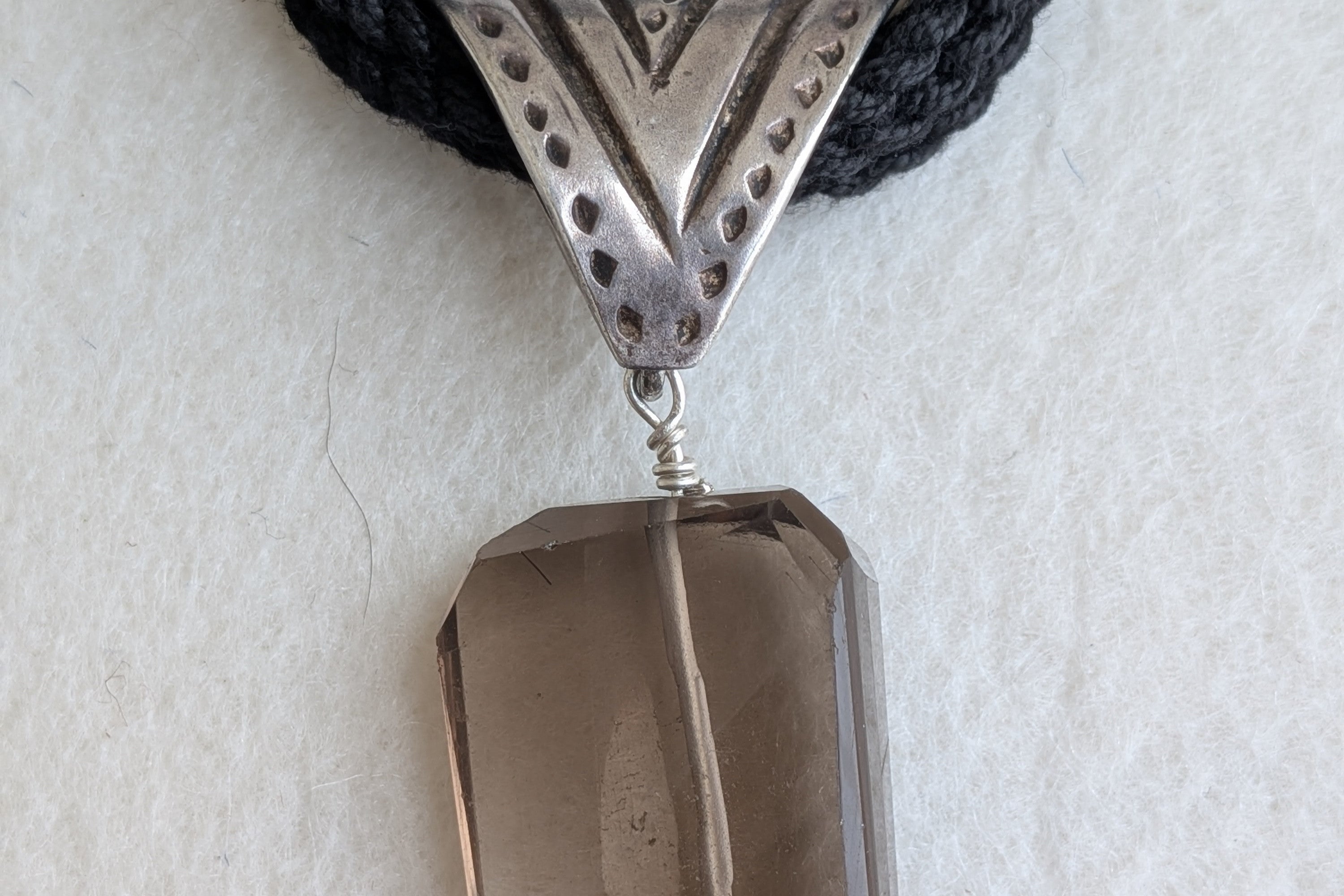 Handcrafted 925 silver triangle pendant adorned with smokey quartz. Perfect for weddings and festivals