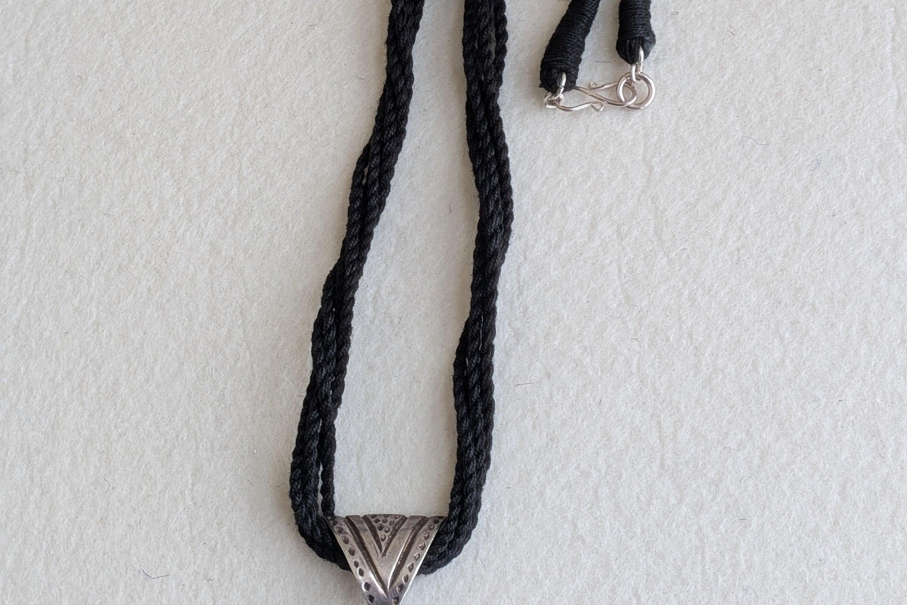 Handcrafted 925 silver triangle pendant adorned with smokey quartz. Perfect for weddings and festivals