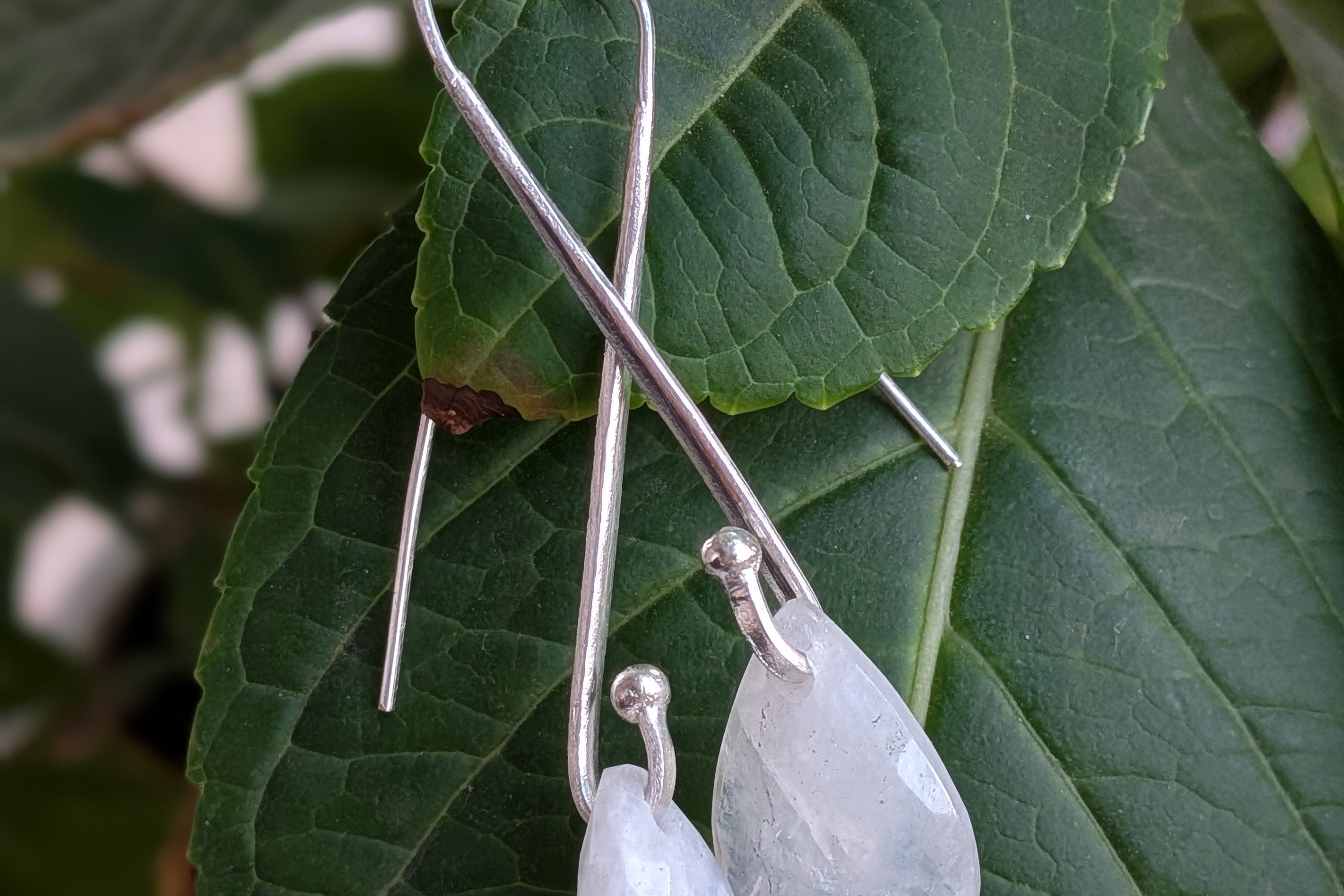 Handcrafted 925 sterling silver U-hook earrings with genuine Rainbow Moonstone drop. Ethereal shimmer, prosperity energy, and everyday luxury