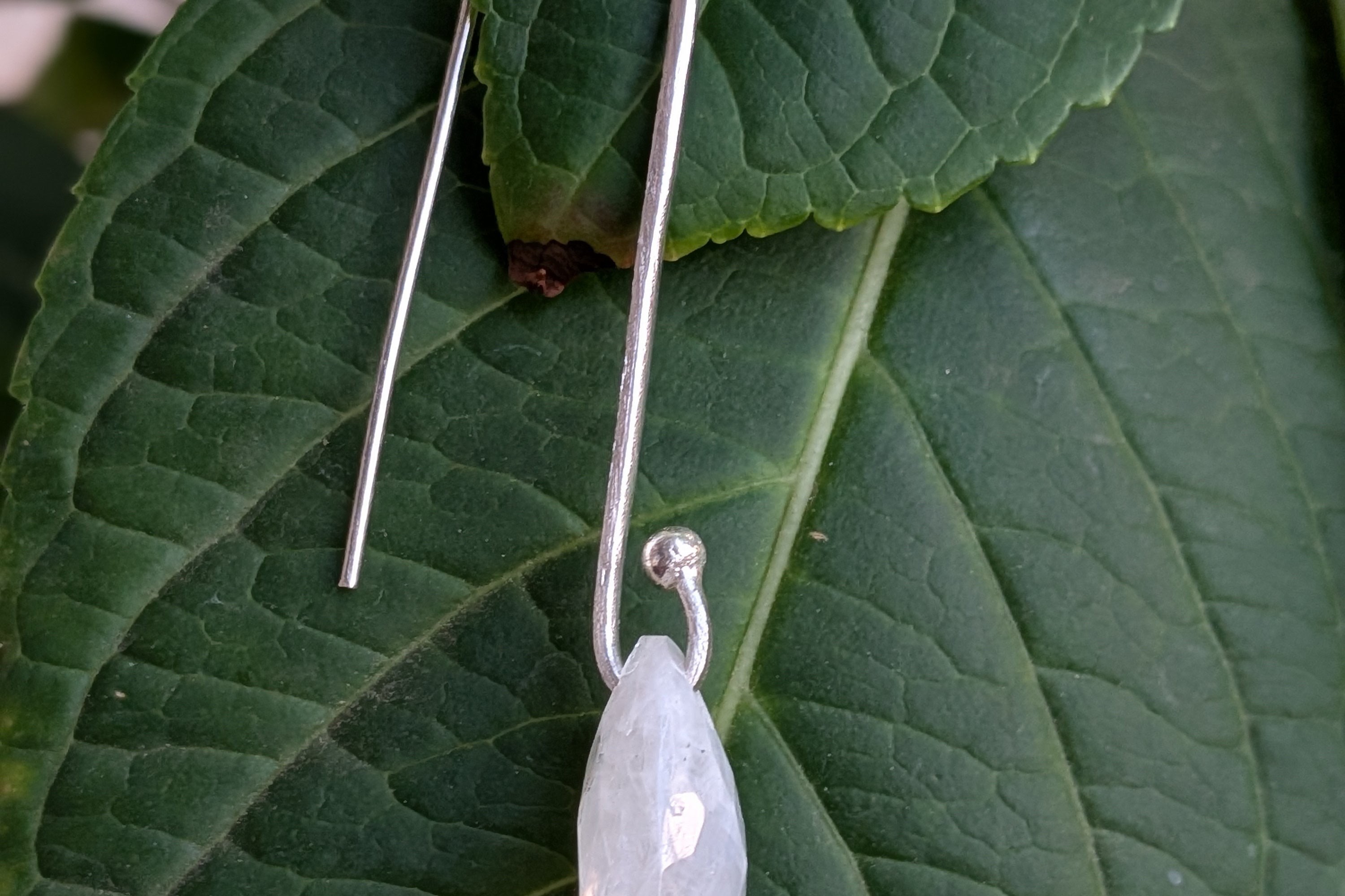 Handcrafted 925 sterling silver U-hook earrings with genuine Rainbow Moonstone drop. Ethereal shimmer, prosperity energy, and everyday luxury