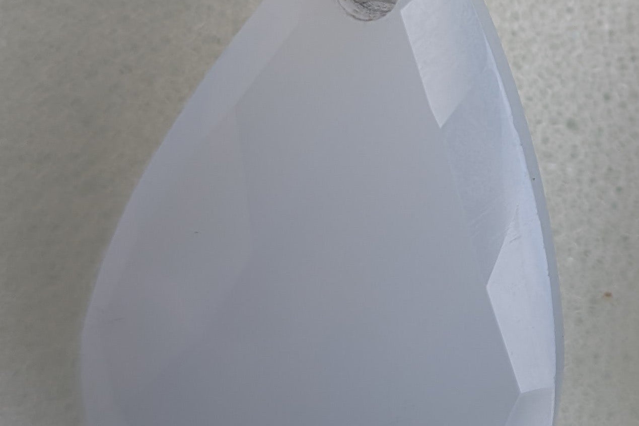 Teardrop-shaped blue chalcedony earrings with silver hooks
