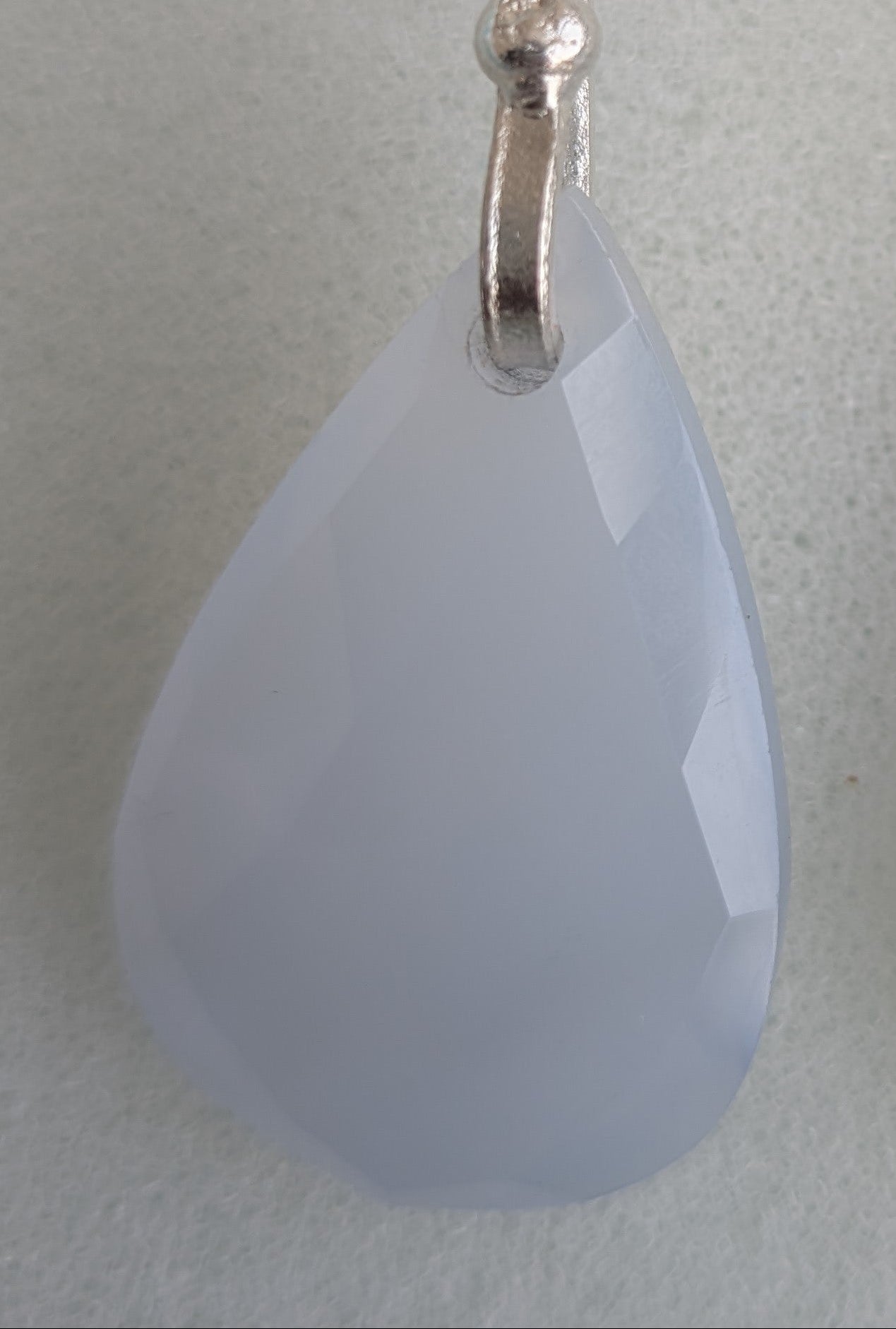 Teardrop-shaped blue chalcedony earrings with silver hooks