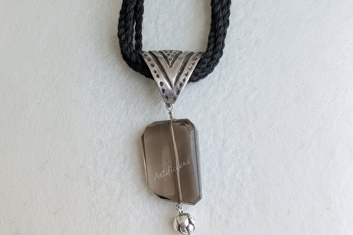 Handcrafted 925 silver triangle pendant adorned with smokey quartz. Perfect for weddings and festivals