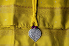Handcrafted 925 silver big leaf pendant on a 21-inch yellow and purple thread dori