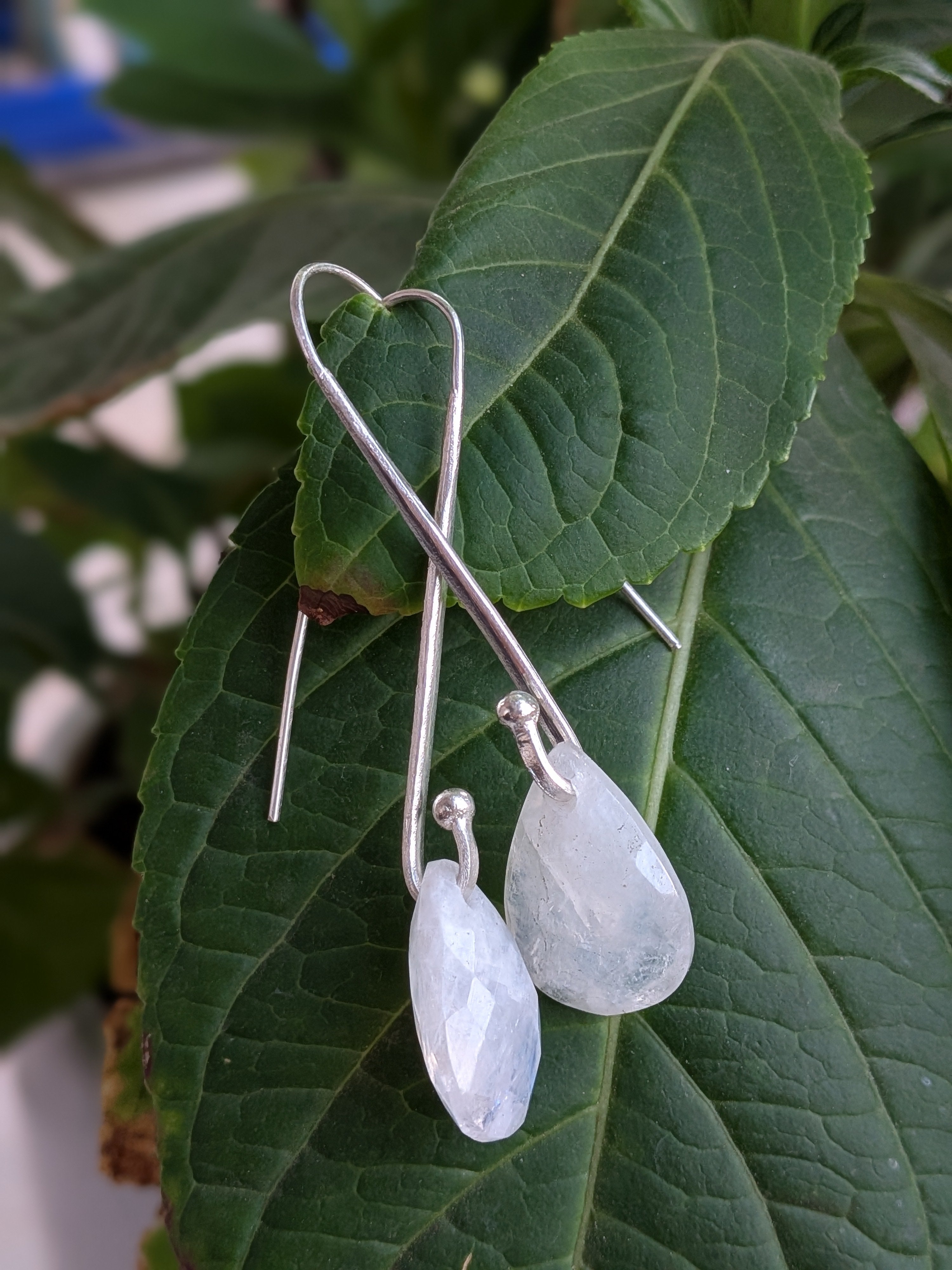 Handcrafted 925 sterling silver U-hook earrings with genuine Rainbow Moonstone drop. Ethereal shimmer, prosperity energy, and everyday luxury