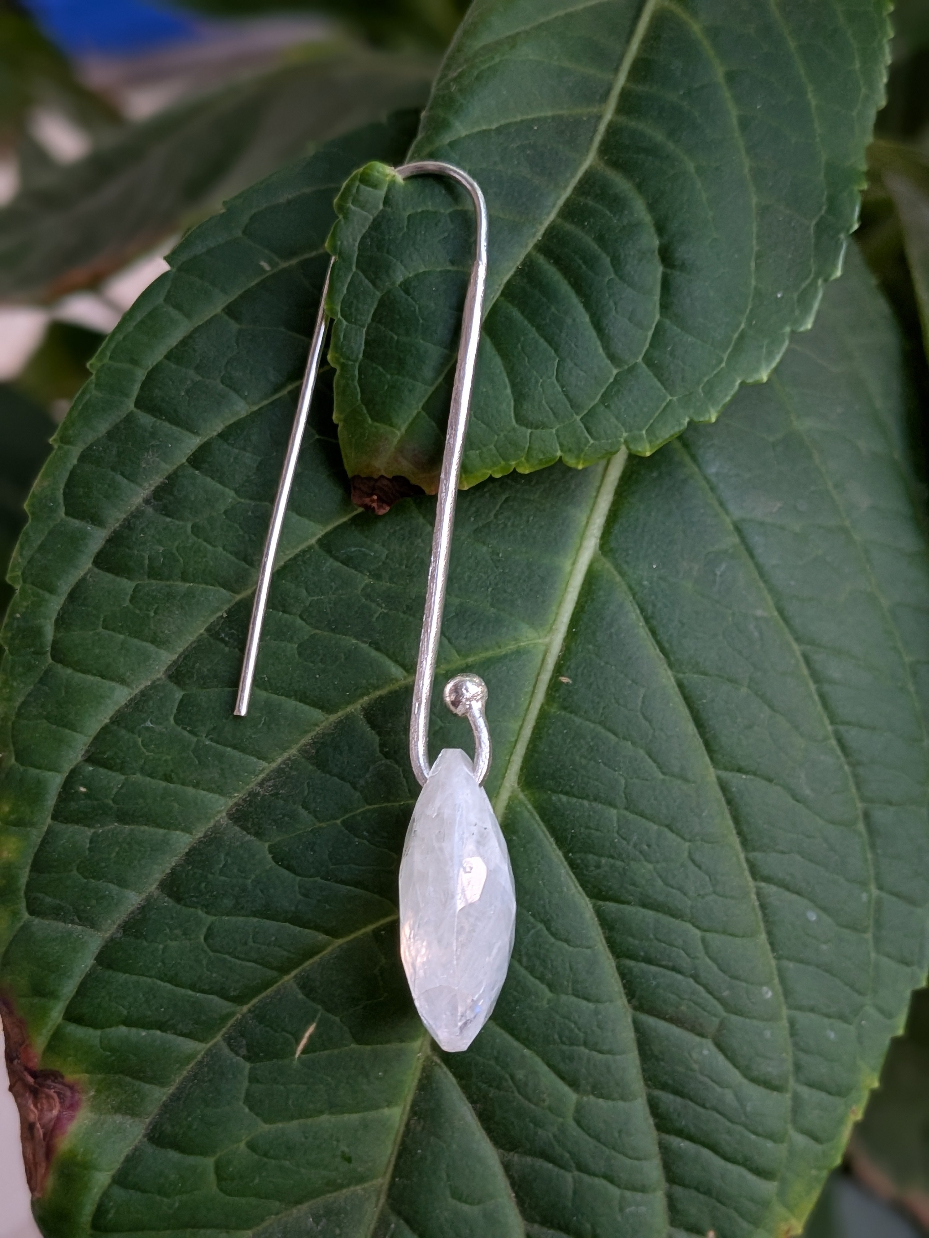 Handcrafted 925 sterling silver U-hook earrings with genuine Rainbow Moonstone drop. Ethereal shimmer, prosperity energy, and everyday luxury