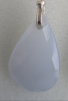 Teardrop-shaped blue chalcedony earrings with silver hooks